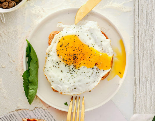 Delicious sunny-side-up egg on toast, highlighting choline-rich foods.
