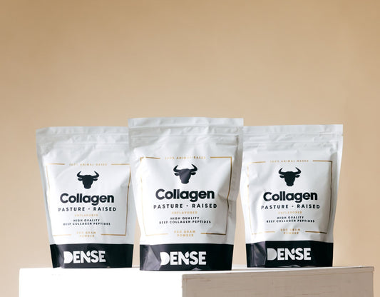 3 bags of DENSE Pasture-Raised Collagen Powder standing on a podium
