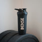 Smartshake Stainless Steel shaker bottle on weights, showcasing minimalistic design and sustainable material.